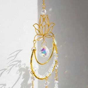 Detail showing natural crystals and prism ball suncatcher creating rainbow light reflections