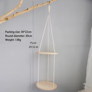 Detailed view of handmade dual-tier hanging wood shelf with bohemian woven cotton rope