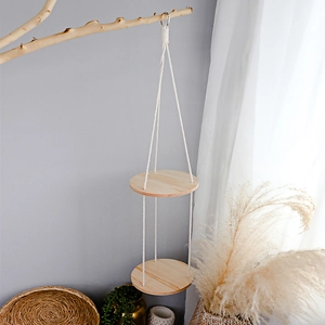 Detail of bohemian handmade woven cotton rope and double layered round wooden shelves