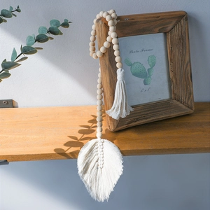 Bohemian curtain tieback with wooden beads and handmade macrame leaf tassel detail