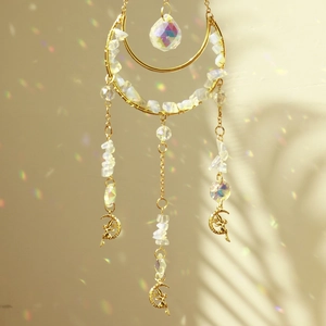 Detailed suncatcher view with natural crystal stones and hanging metal fairy charms