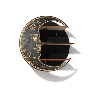 Minimalist black wooden moon shaped wall shelf with bohemian crescent face carvings