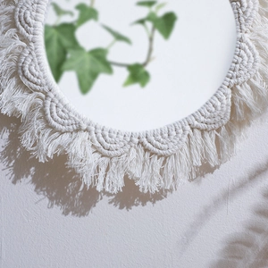 Handmade bohemian wall mirror with white cotton macrame weave and fringe tassels