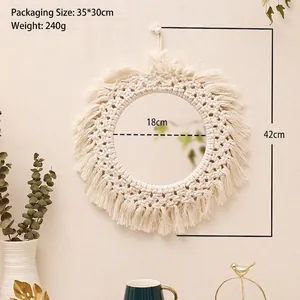 Detail of bohemian woven cotton fringe mirror with dimensions 42cm height and 18cm diameter