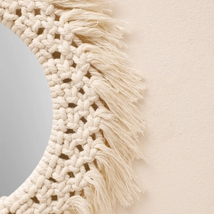 Bohemian macrame wall mirror with handmade cotton rope weaving and elegant fringe details