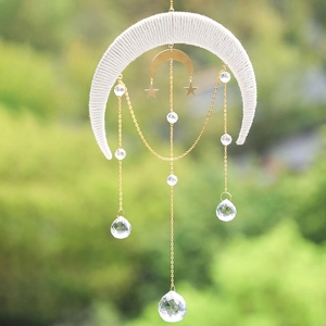 Detailed view of bohemian crescent moon suncatcher with crystal prisms and golden chains