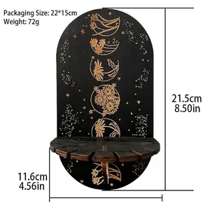 Detail view of black wooden moon phase shelf with golden floral engraving and display tray