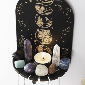 Wooden wall-mounted moon phase shelf with gold floral etchings for crystal display