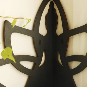 Close-up of black carved lotus wooden corner shelf with intricate hollow-out wall decor