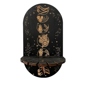 Elegant black and gold wooden wall shelf for crystals with celestial botanical carvings