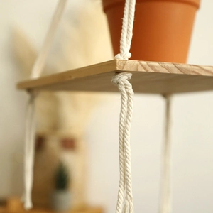 Handmade Bohemian hanging shelf with natural cotton rope and multi-layer wooden boards