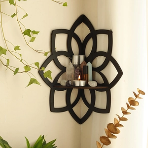 Detail of wooden lotus corner shelf with mandala cutout for crystals and home decor