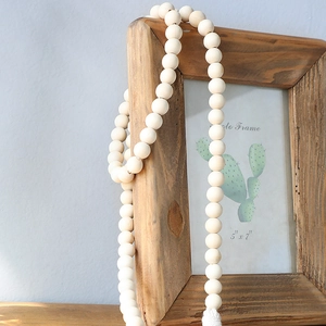 Bohemian curtain tieback with natural wood beads and white cotton tassel for home decor