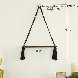 Bohemian black macrame wall shelf with dark wood base for minimalist home decor