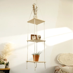 Three-tier square wooden hanging shelf with handmade macrame cotton ropes in boho style