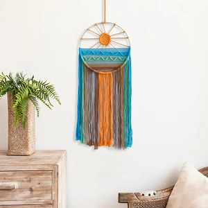 Handwoven sunrise wall hanging with colorful cotton tassels for boho home wall decor
