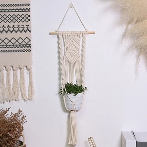 Handmade macrame plant hanger with wooden rod and bohemian woven cotton rope tassels