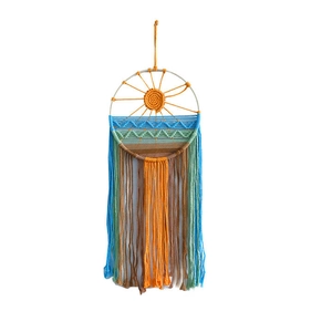 Handmade woven wall hanging with sunrise and waves design featuring colorful cotton tassels