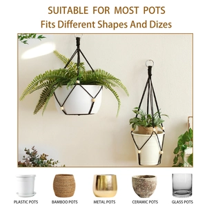 Detail showing the black macrame plant hanger compatible with various pot materials and shapes