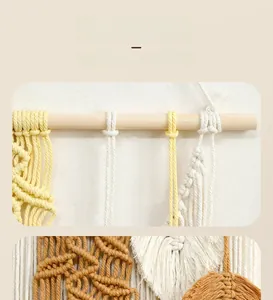 Detailed close-up of handmade bohemian woven wall hanging with cotton macrame texture