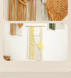 Close-up of hand-woven bohemian macrame wall hanging with leaf tassels and cotton ropes