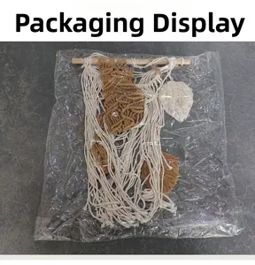 Detail showing handcrafted macrame wall hanging in transparent protective packaging