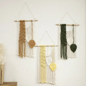 Bohemian handmade cotton fringe wall hanging set with wooden rods and leaf accents