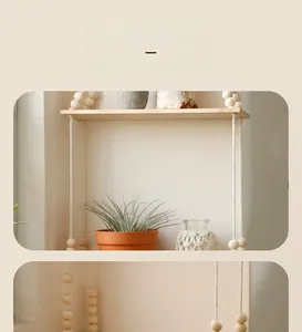 Detail view of woven cotton rope with wooden beads on a wall hanging storage shelf