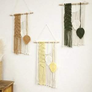 Bohemian macrame wall hanging set with cotton tassels and feather leaves on wooden rods