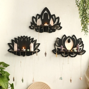 Three-piece black lotus wooden wall shelves displaying crystals and stone pendants