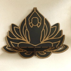 Detail view of a laser-cut wooden yoga lotus wall shelf with a black yoga silhouette