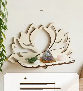 Close-up of wooden lotus wall shelf displaying crystals and energy tower decor