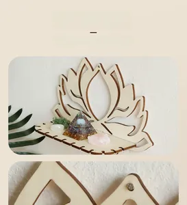 Detail view of a hollow lotus wooden wall shelf displaying healing crystals and pyramid