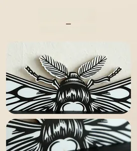 Macro detail of wooden moth wall shelf showing precise laser-cut symmetry and patterns