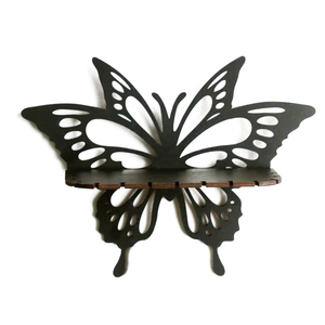 Minimalist black butterfly wooden wall shelf with laser-cut hollow details and display tray