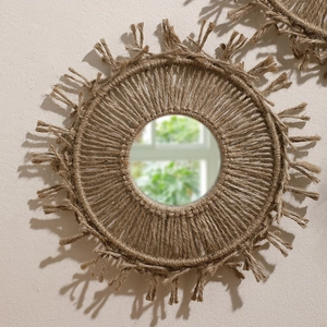 Close-up of bohemian woven brown cotton fringe details and natural hemp texture on mirror