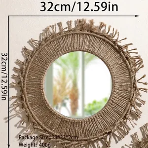 Close-up of Bohemian hand-woven round wall mirror with brown cotton fringe details