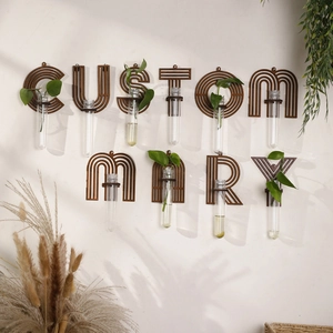 Detail of wooden letter frame and glass test tube for wall hydroponic plant decoration