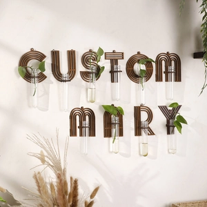 Detail of wooden letter frame with glass test tube for hydroponic plants home wall decor