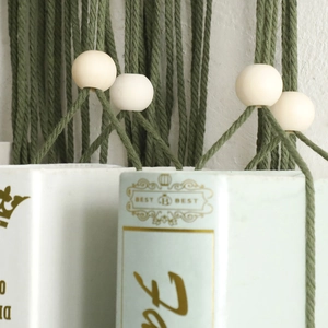 Handmade Bohemian olive green cotton rope wall hanging with natural wooden beads