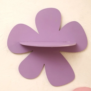 Detail view of purple flower shaped wooden wall shelf with a semi-circular display ledge