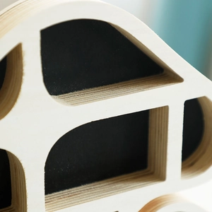 Detail showing the layered wood texture and precise edges of the mushroom storage shelf
