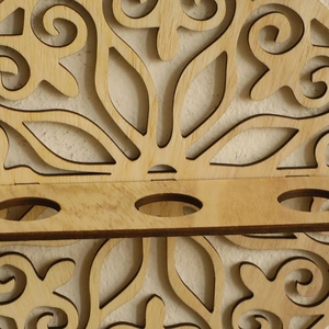 Minimalist wall-mounted round wooden flower pot with intricate laser-cut floral carvings