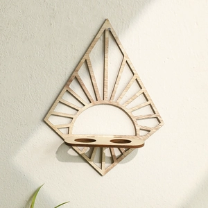 Detail of wooden fan-shaped wall shelf with sunburst patterns and two test tube slots