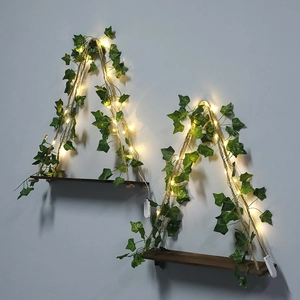 Bohemian hanging wooden wall shelves with artificial ivy and warm LED string lights