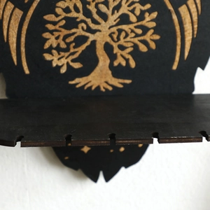 Detailed laser-engraved Tree of Life motif on a dark wooden wall crystal display shelf