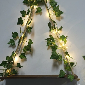 Bohemian hanging shelf with artificial ivy leaves and warm LED string lights decor