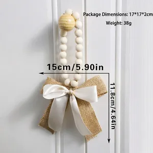 Macro shot of rustic wooden beads with a dual-layer burlap and satin bow wall hanging