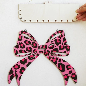 Pink leopard print wooden bow wall shelf for bohemian home decor and storage