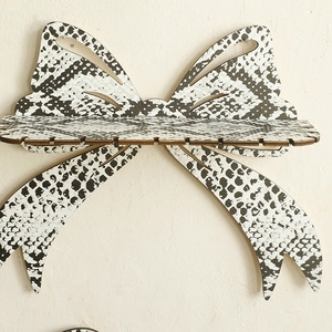 Bohemian bow-shaped wooden wall shelf with black and white snake skin pattern for home decor